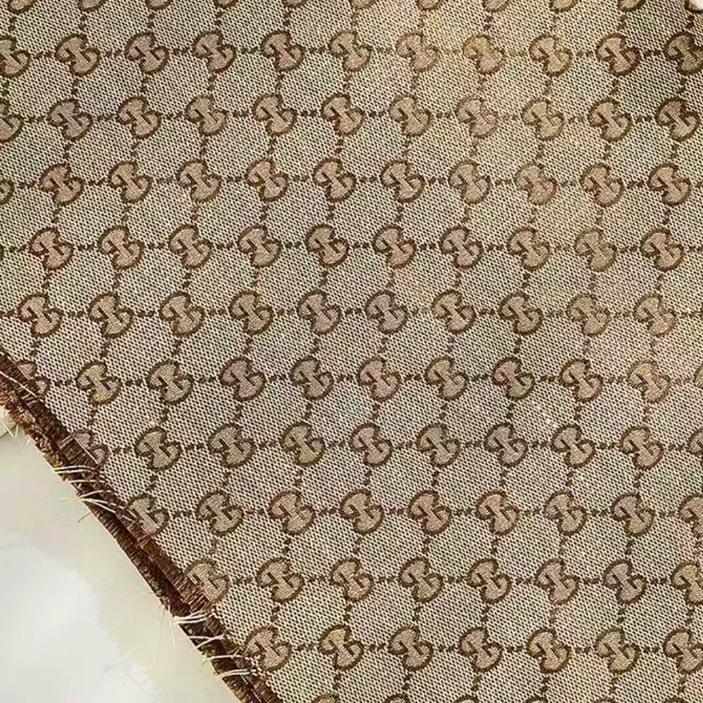 FAB (20) Brown Geometric Monogram Fabric - Image 1